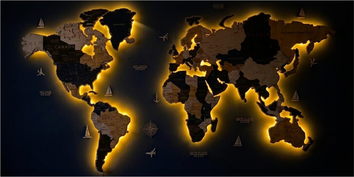 Pinelini 3D LED wooden world map with warm backlighting installed on a wall